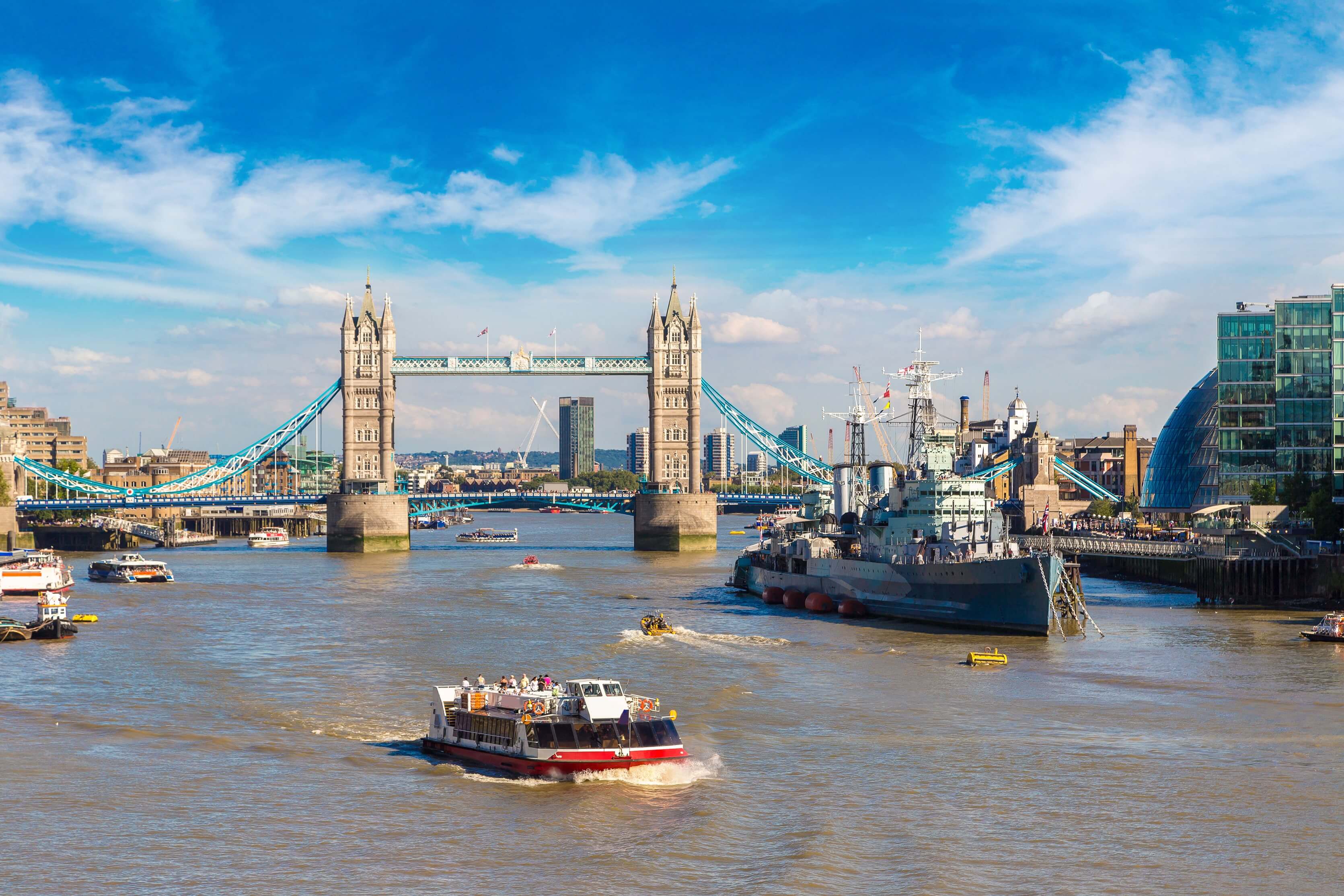 HMS Belfast warship and Tower Bridge in London in a beautiful summer day, England, United Kingdom